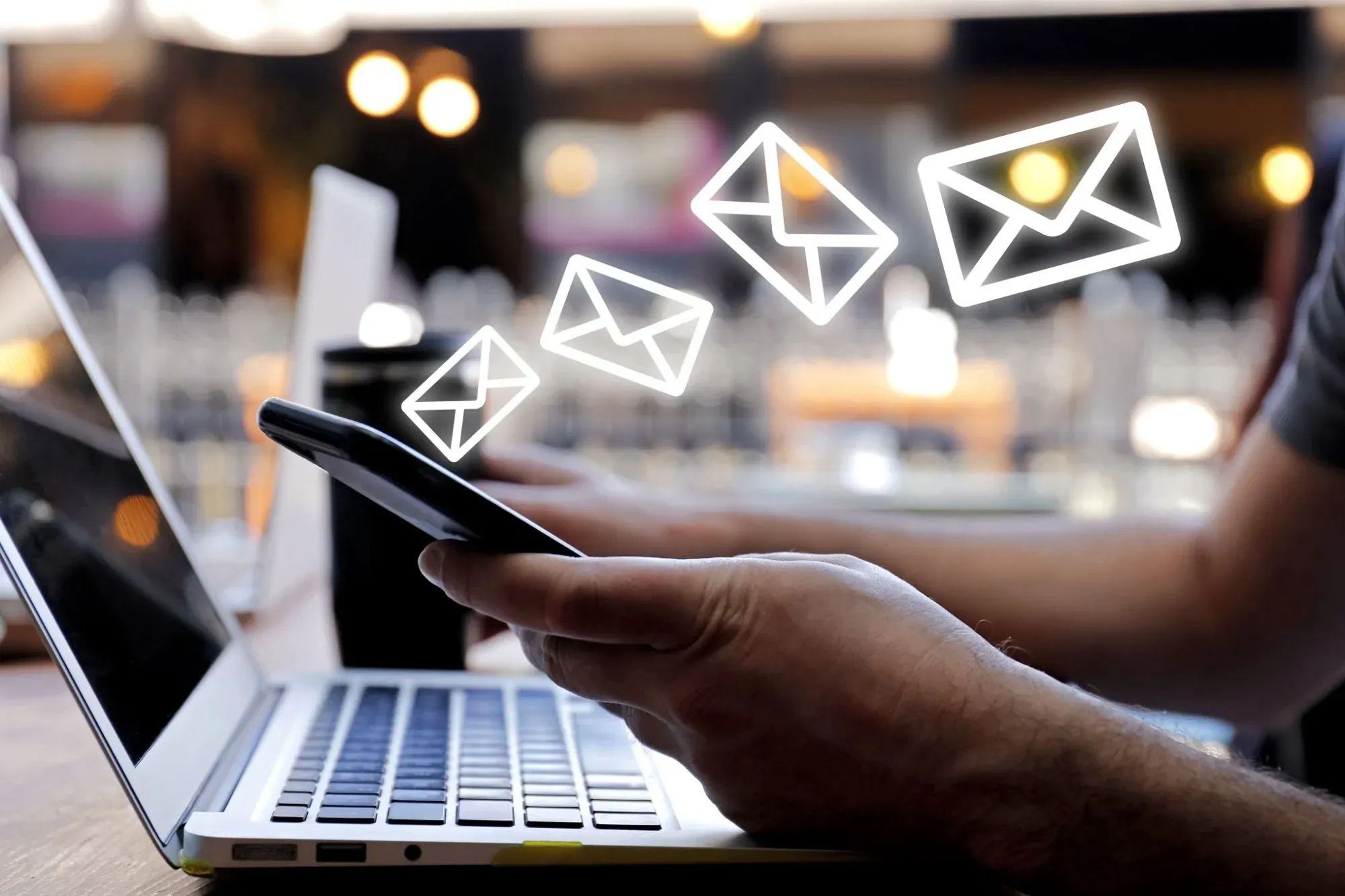 Someone receiving emails to their phone